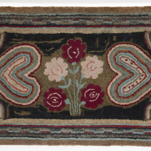 Hooked rug with hearts and flowers